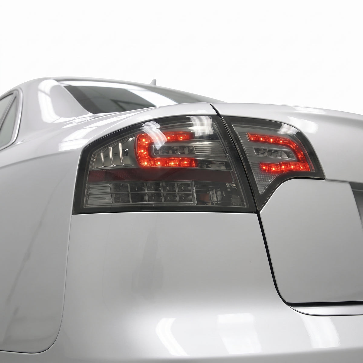 Audi A4 B7 (2005 - 2008) Smoke Black LED Tail Lights LH + RH installed close-up