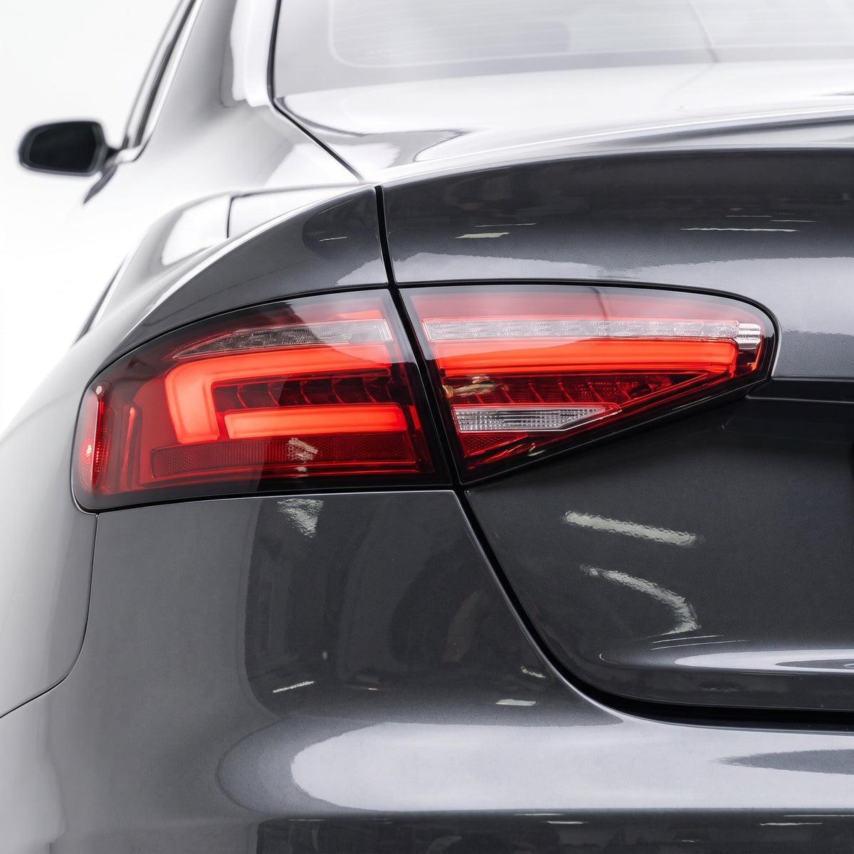 Audi A4 B8 (2012 - 2015) For models with stock LED tail lights only Clear Red Sequential 3D LED Stripe Tail Lights LH + RH installed close-up
