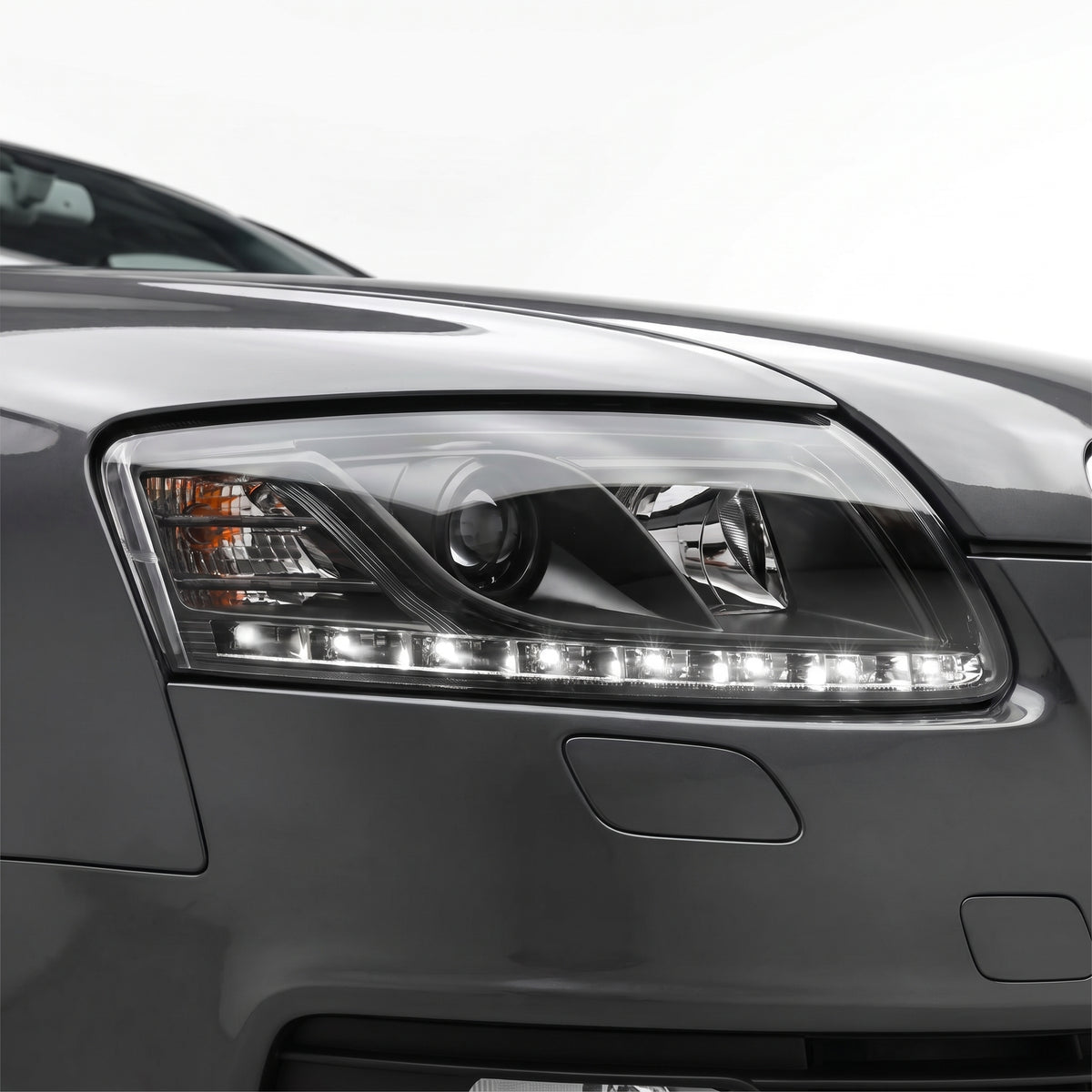 Audi A6 C6 (2004 - 2011) Black LED DRL Projector Headlights LH + RH installed close-up