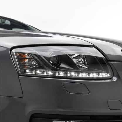 Audi A6 C6 (2004 - 2011) Black LED DRL Projector Headlights LH + RH installed close-up