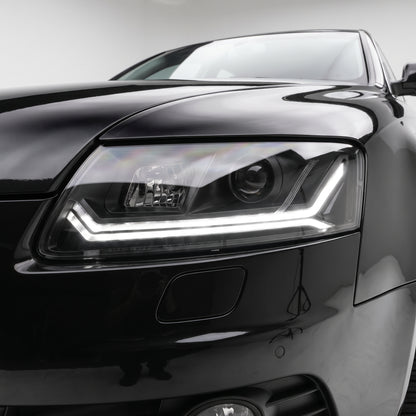 Audi A6 C6 (2004 - 2011) Sequential Black LED DRL Projector Headlights LH + RH installed close-up