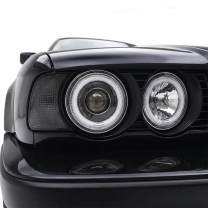 BMW 5 Series E34 (1987 - 1996) Crystal Clear CCFL Angel-Eye Projector Headlights LH + RH installed close-up