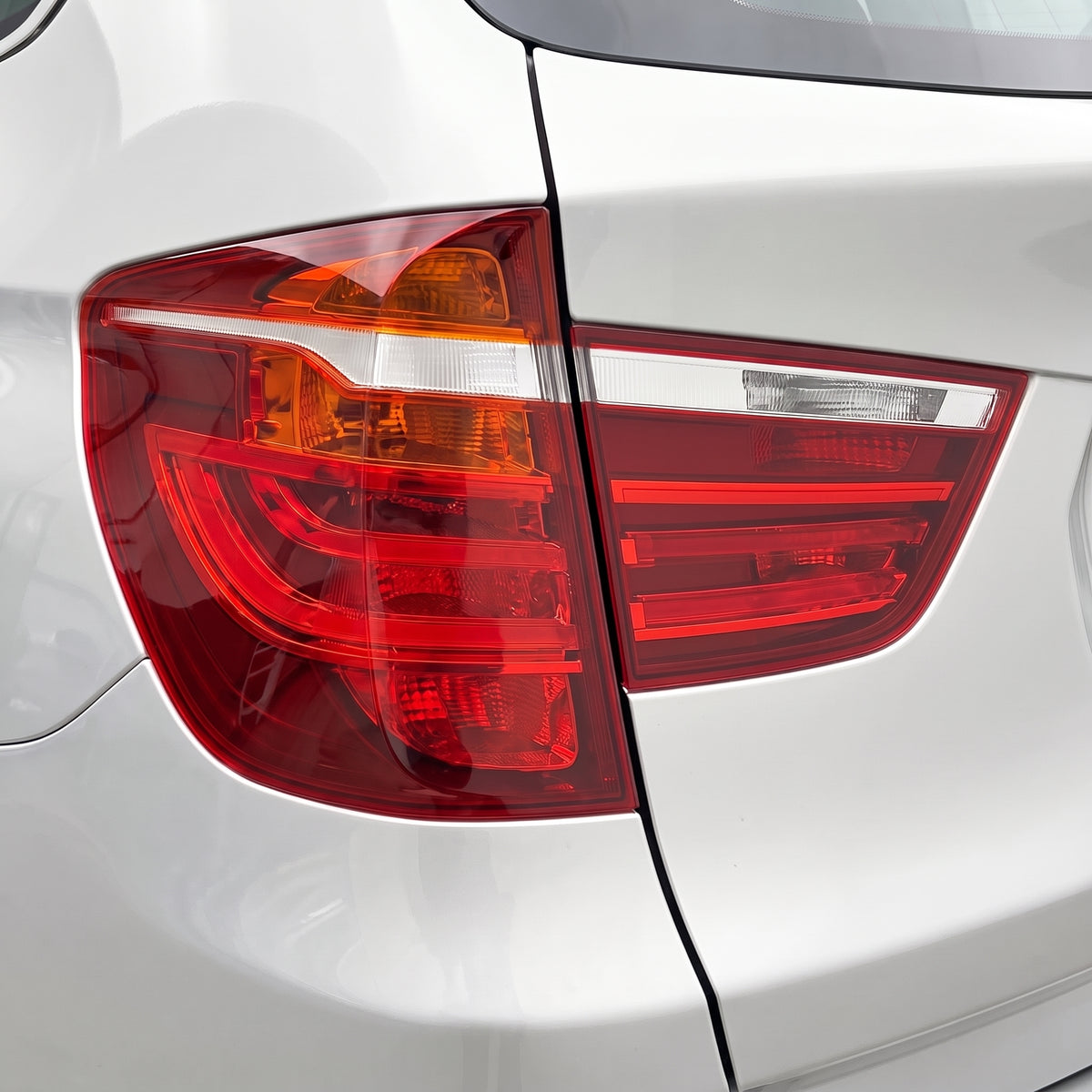 BMW X3 F25 (2010 - 2017) OEM Style Non LED Tail Lights LH + RH installed close-up