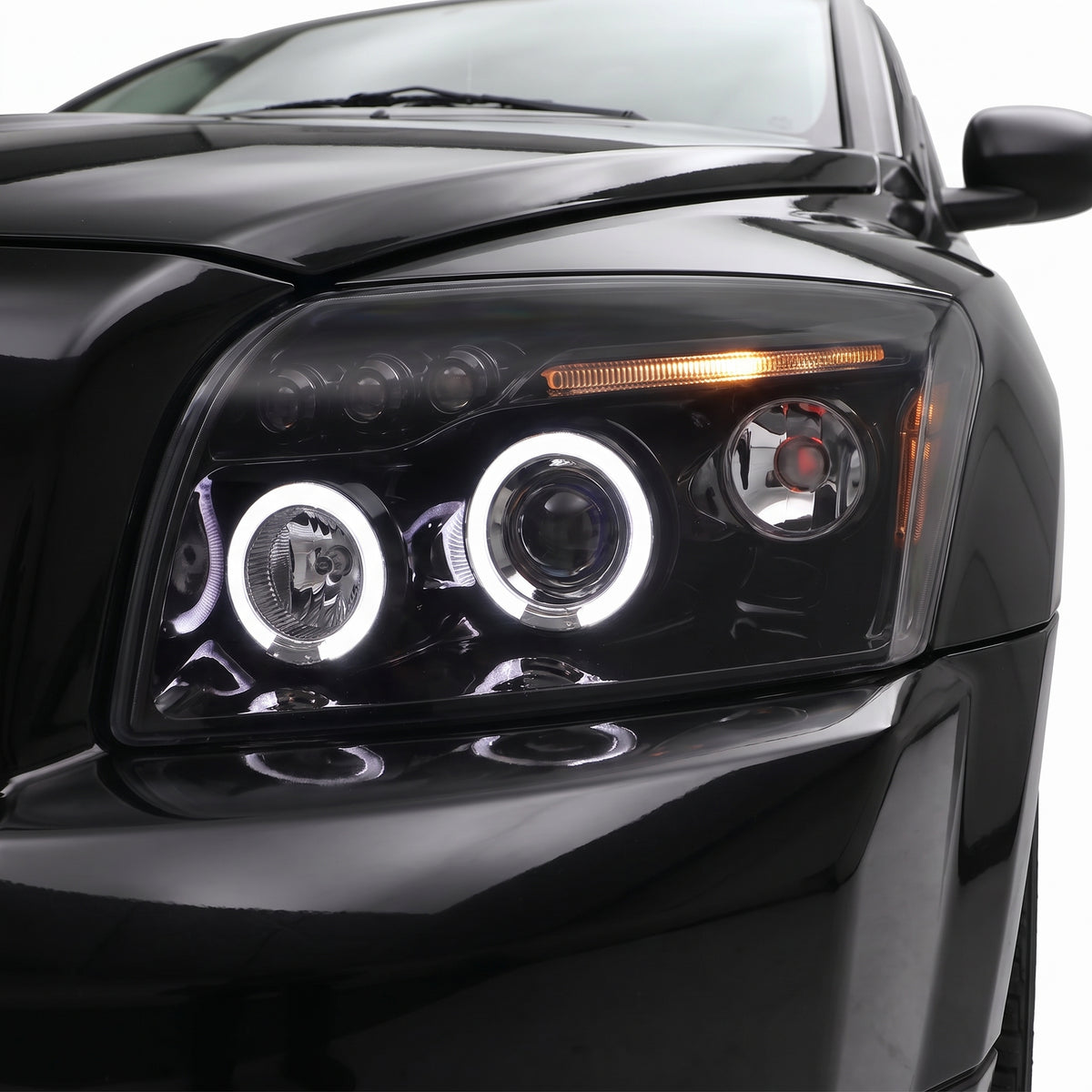 Dodge Caliber PM (2006 - 2012) Angel-Eyes DRL Projector Headlights LH + RH installed close-up