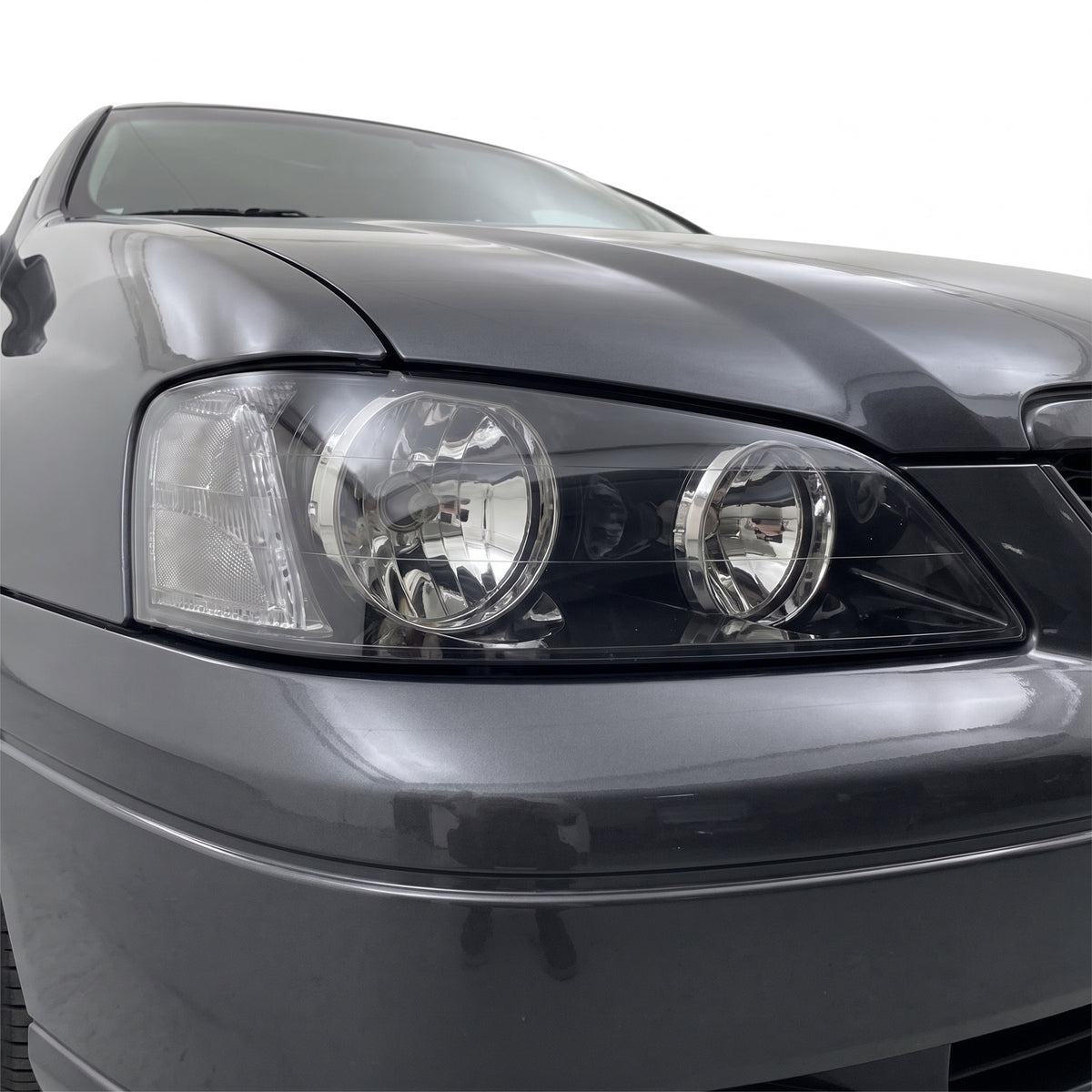 Ford Falcon BA Series 1 & 2 XT (2002 - 2005) Black OEM Style Headlights LH + RH installed close-up