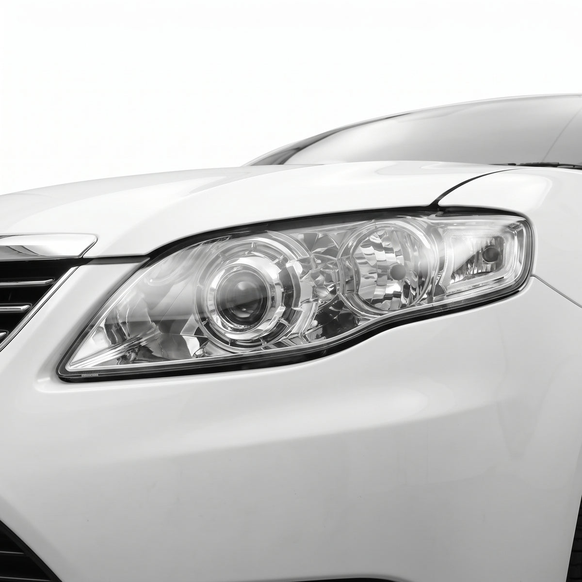 Ford Falcon FG Series 2 G6E (2011 - 2014) Chrome Projector Headlights LH + RH installed close-up
