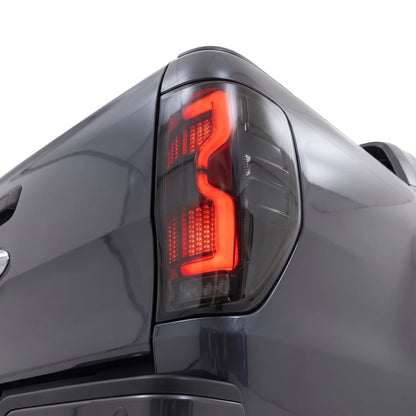 Ford Ranger PX MK1 / MK2 / MK3 (2011 - 2021) Smoked 3D Stripe Bar Full LED Tail Lights LH + RH installed close-up