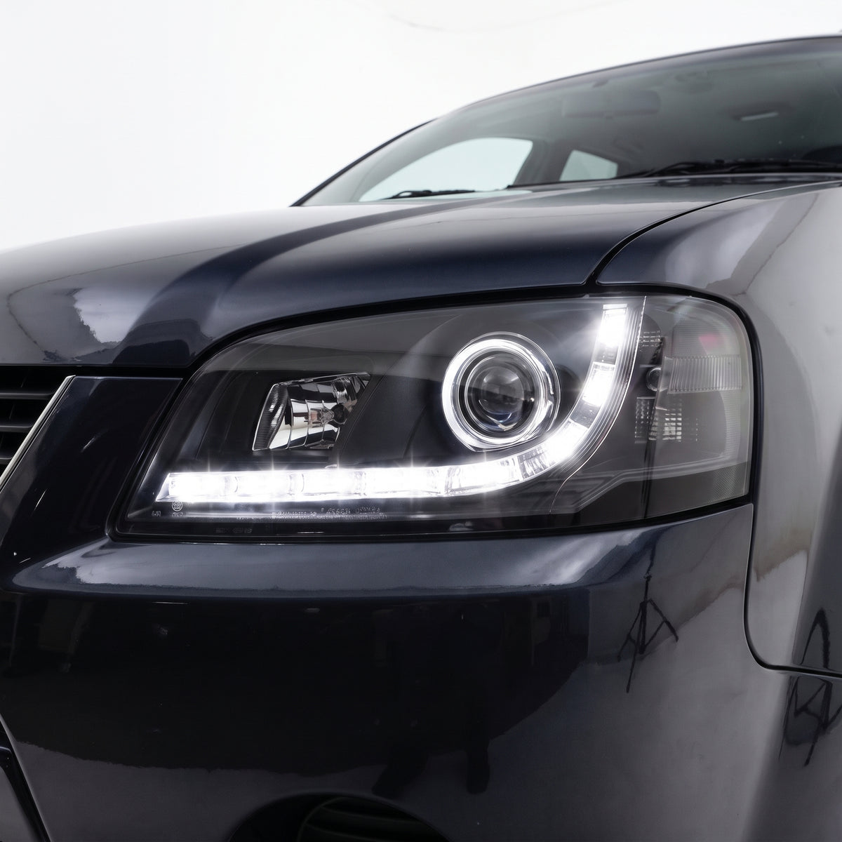 Ford Territory SX / SY (2004 - 2009) LED DRL Style Projector Headlights LH + RH installed close-up
