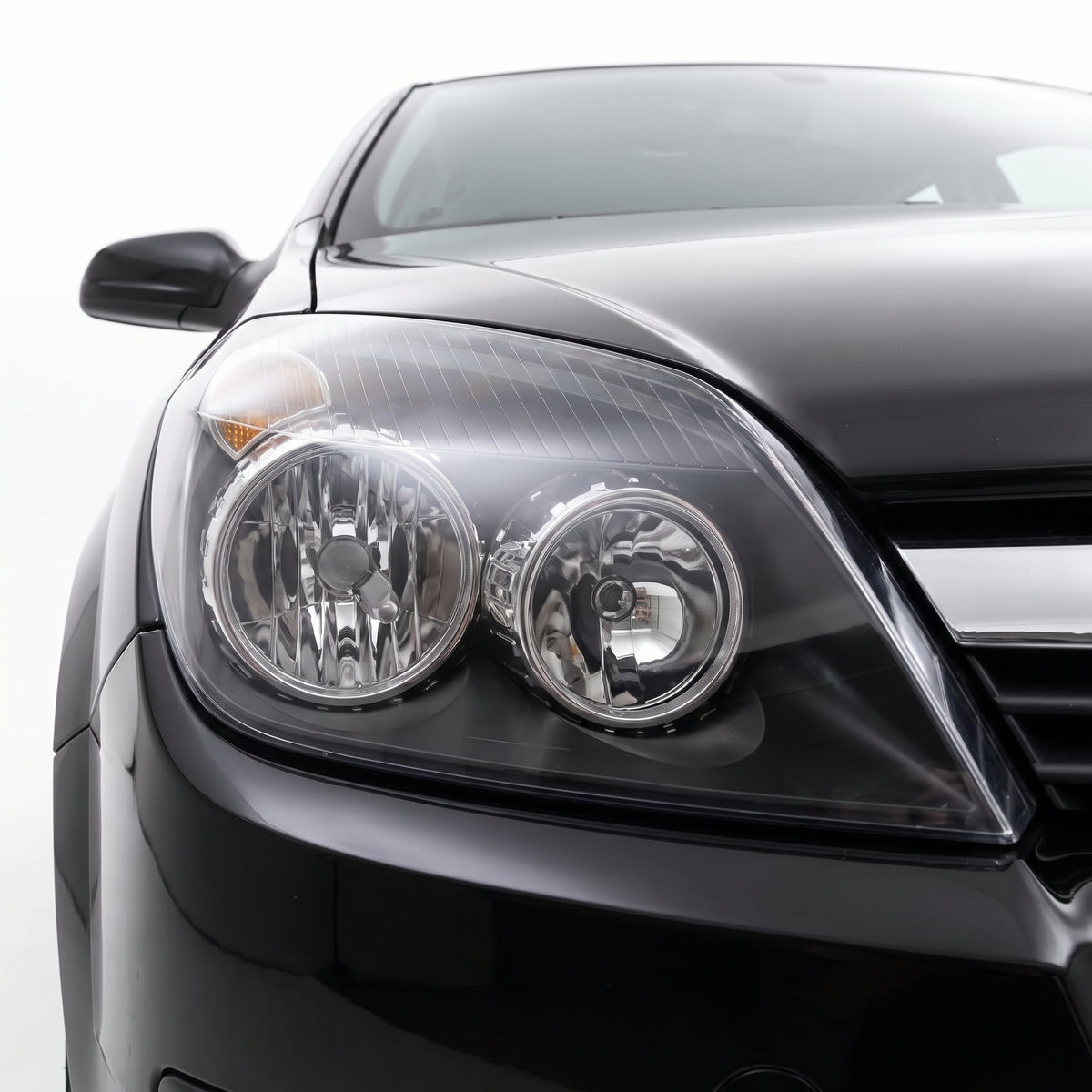 Holden Astra AH (2004 - 2010) Black OEM Style Headlights LH + RH installed close-up