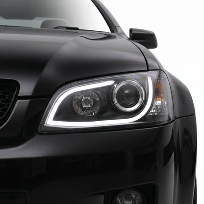 Holden Commodore VE Series 1 (2006 - 2009) Black DRL LED Projector Headlights LH + RH installed close-up