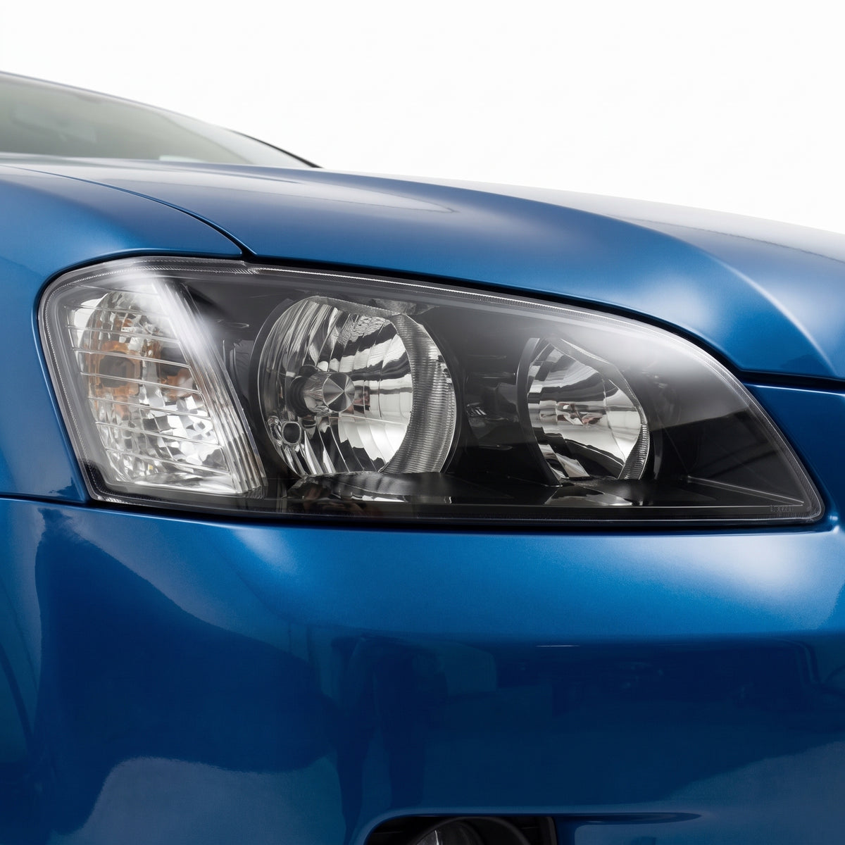 Holden Commodore VE Series 1 (2006 - 2010) Black Non-Projector OEM Replacement Headlights installed close-up
