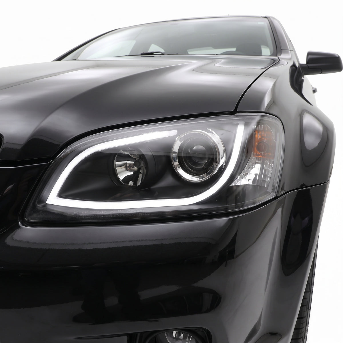 Holden Commodore VE Series 2 (2009 - 2013) Black LED 3D DRL Projector Headlights LH + RH installed close-up