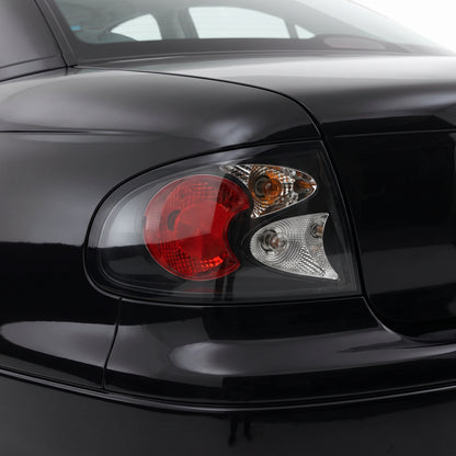 Holden Commodore VT / VX / VY / VZ (1997 - 2007) Black Altezza Halogen Tail Lights LH + RH