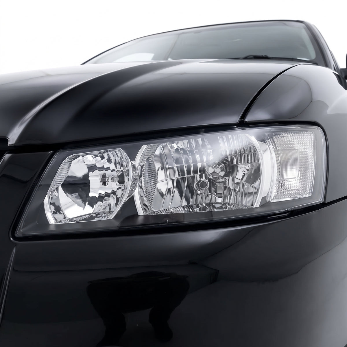 Holden Commodore VZ SV6 (2004 - 2007) Black OEM Style Headlights LH + RH installed close-up