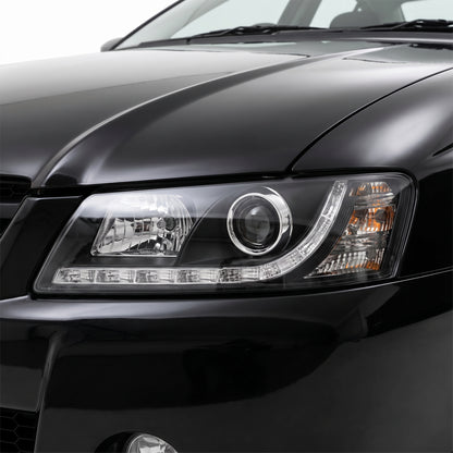 Holden Commodore VZ (2004 - 2007) Black DRL LED Projector Headlights LH + RH