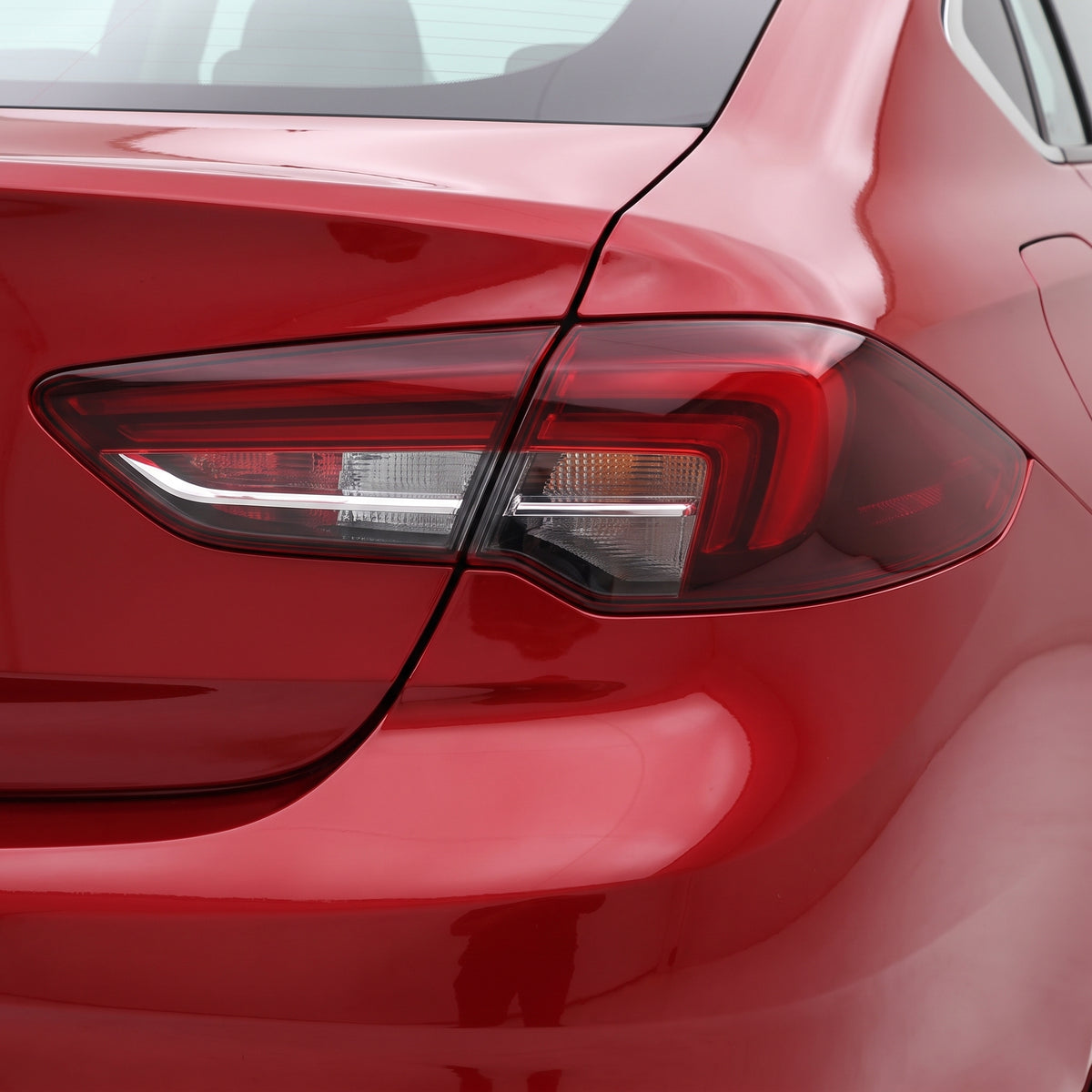 Holden Commodore ZB (2018 - 2020) Tinted Red Rear Garnish Tail Lights LH + RH installed