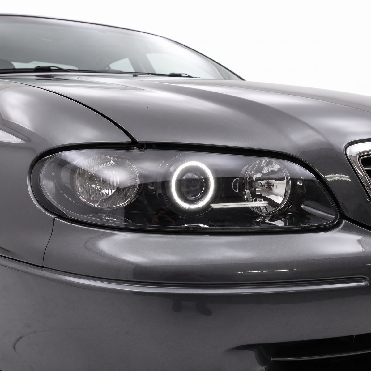 Holden Statesman WH (1999 - 2003) Black LED Halo Angel Eyes Altezza Headlights LH + RH installed close-up