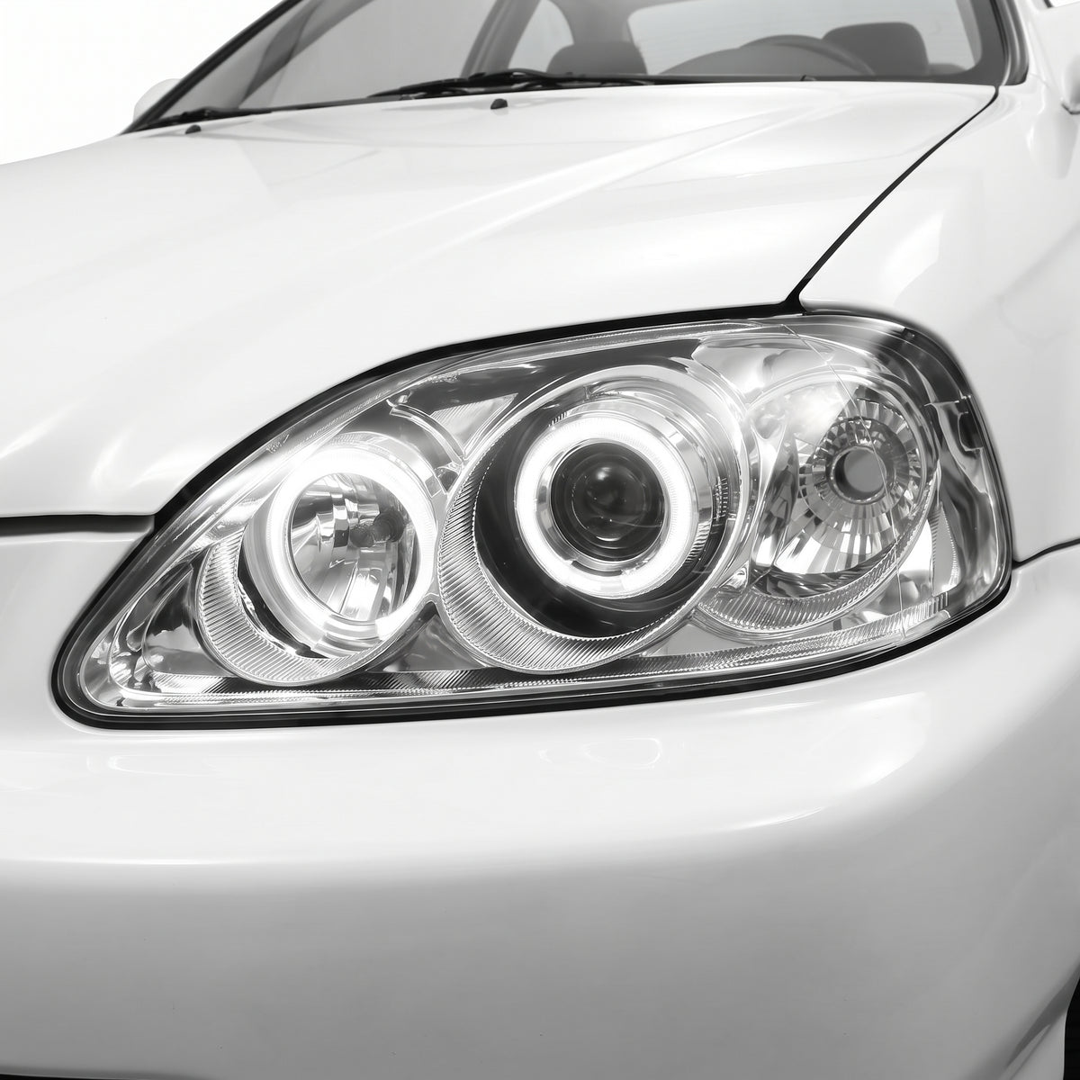 Honda Civic EK (1999 - 2000) Crystal Clear Angel-Eyes Projector Headlights LH + RH installed close-up