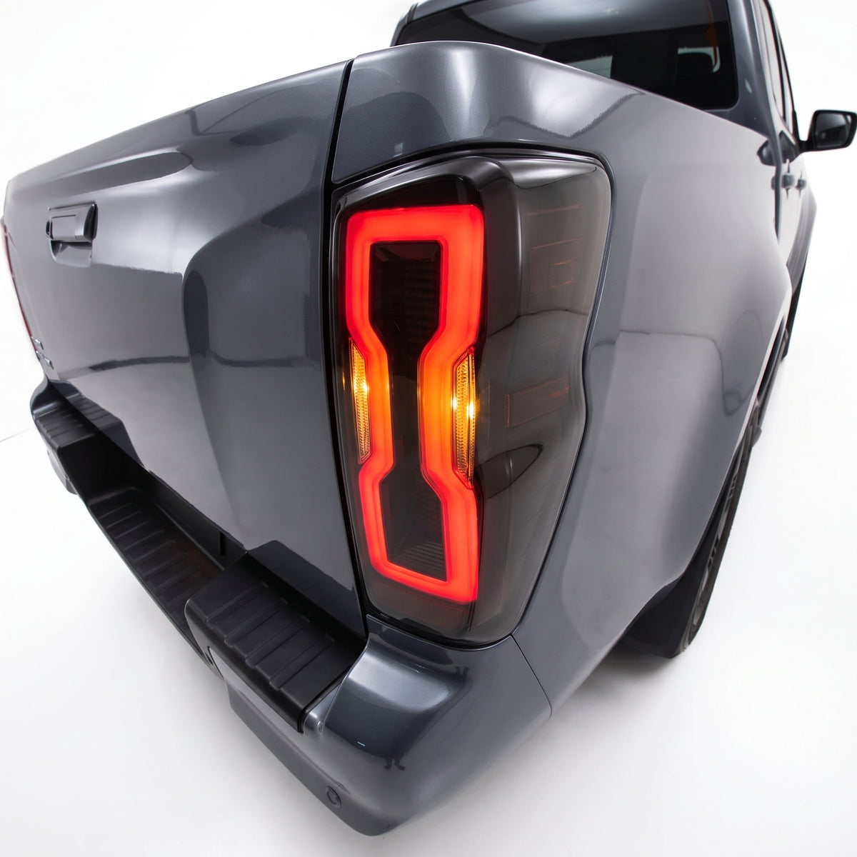 Isuzu D-Max RG (2020 - 2024) Sequential Smoked Black LED Tail Lights LH + RH installed close-up