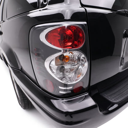 Jeep Grand Cherokee WJ (1999 - 2004) Black Altezza Halogen Tail Lights LH + RH installed close-up