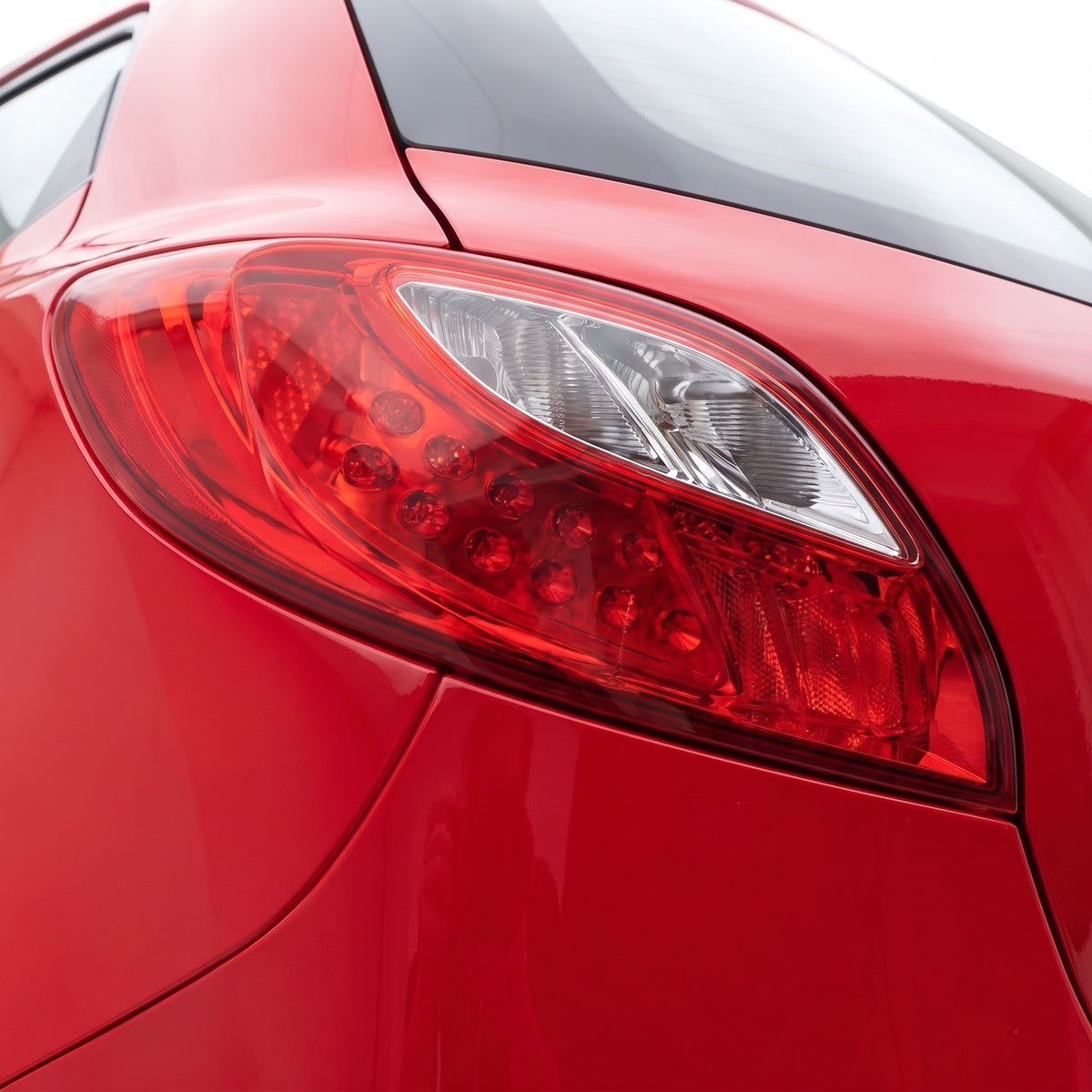 Mazda 2 DE Hatchback (2007 - 2014) Tail Lights LH + RH installed close-up