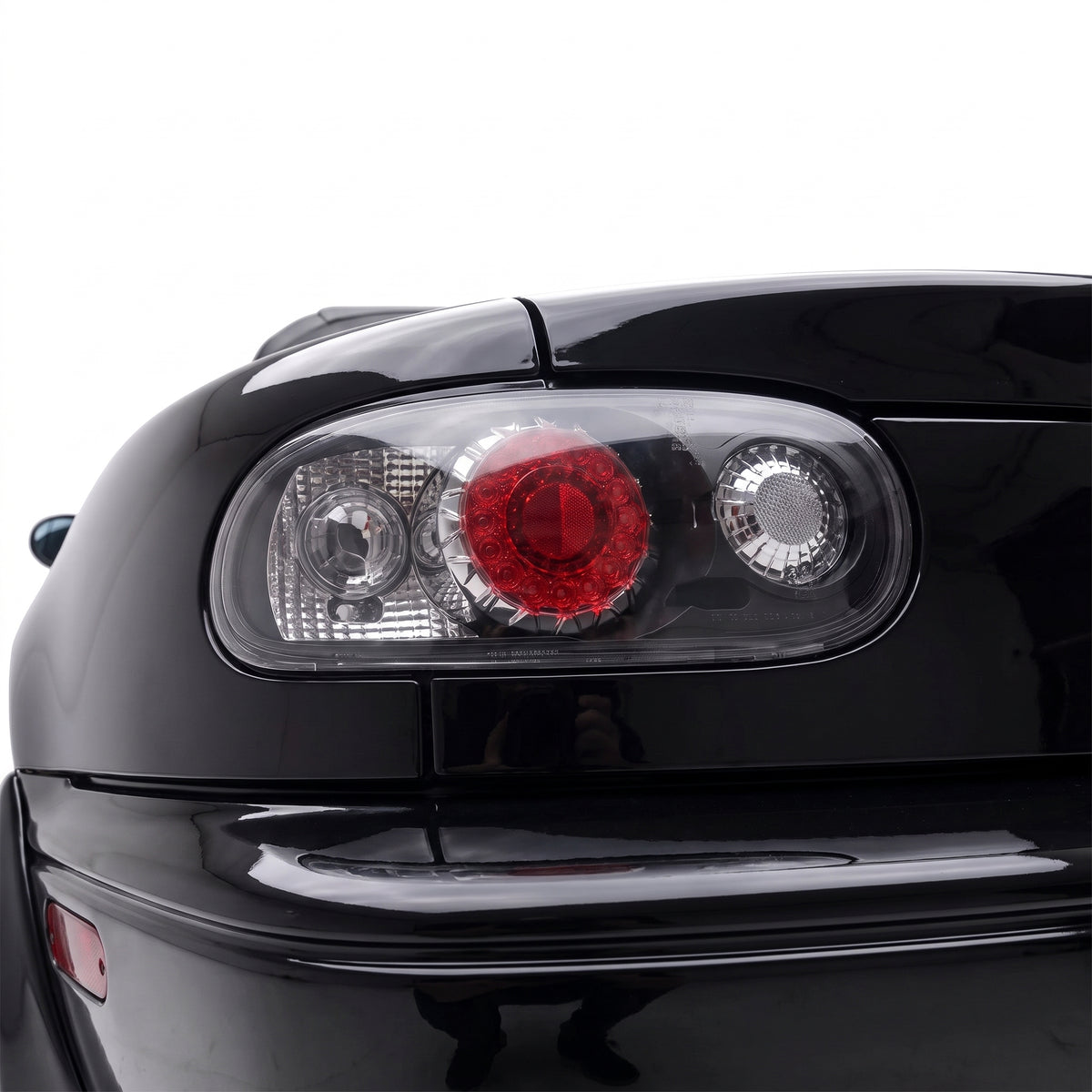 Mazda MX-5 NA (1989 - 1997) JDM Black Altezza LED Tail Lights LH + RH installed close-up