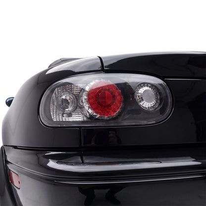 Mazda MX-5 NA (1989 - 1997) JDM Black Altezza LED Tail Lights LH + RH installed close-up