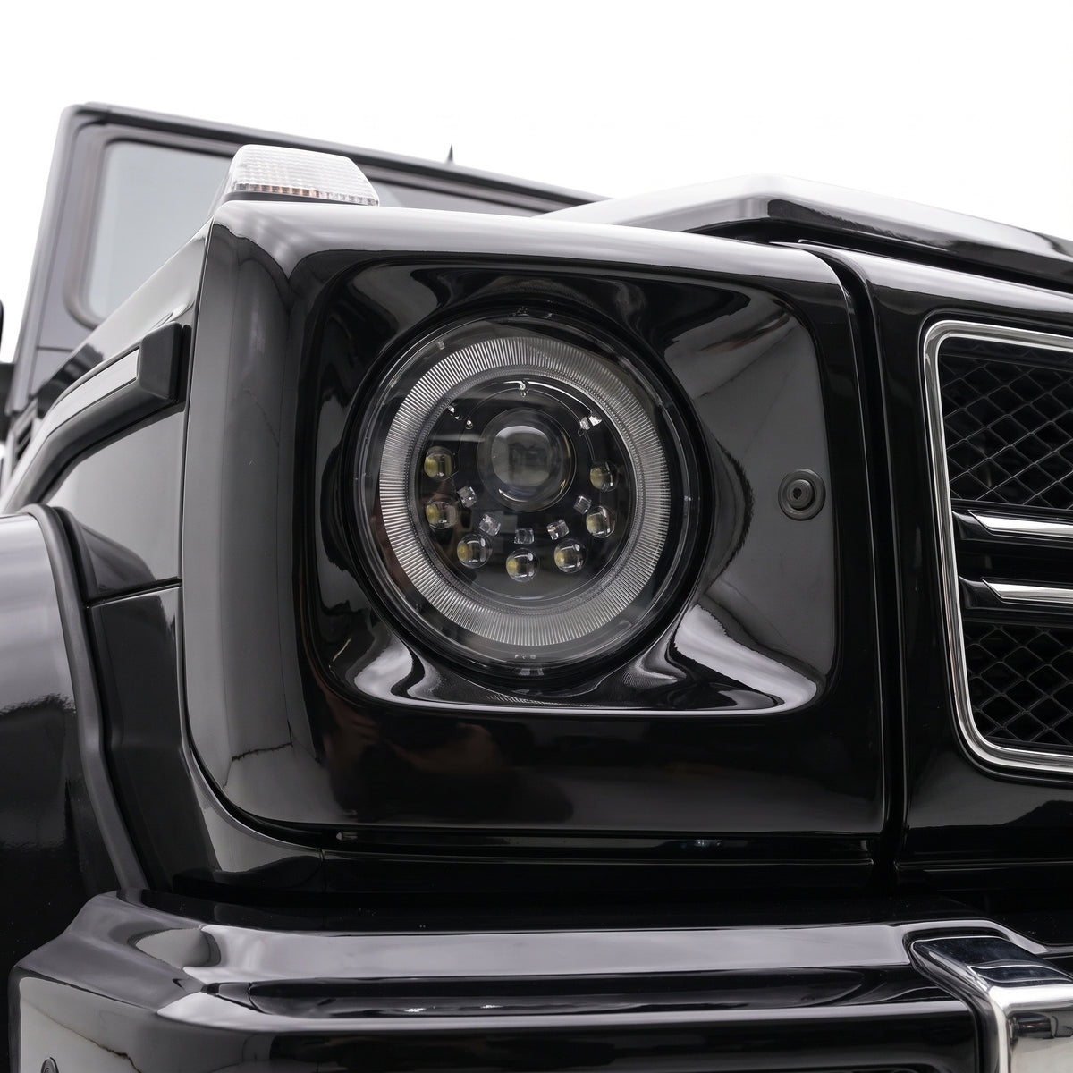 Mercedes-Benz G-Class W463 (1986 - 2018) Full Smoked Mansory Style LED Headlights LH + RH installed close-up