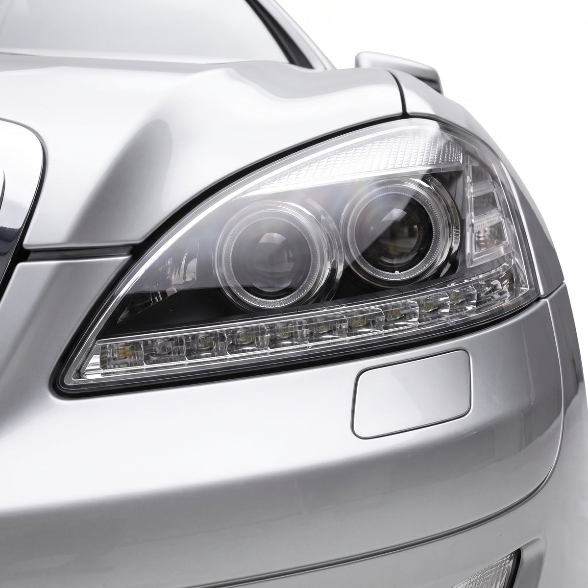 Mercedes-Benz S-Class W221 (2006 - 2009) S65 AMG Style DRL LED Projector Headlights with LED Indicators LH + RH installed close-up