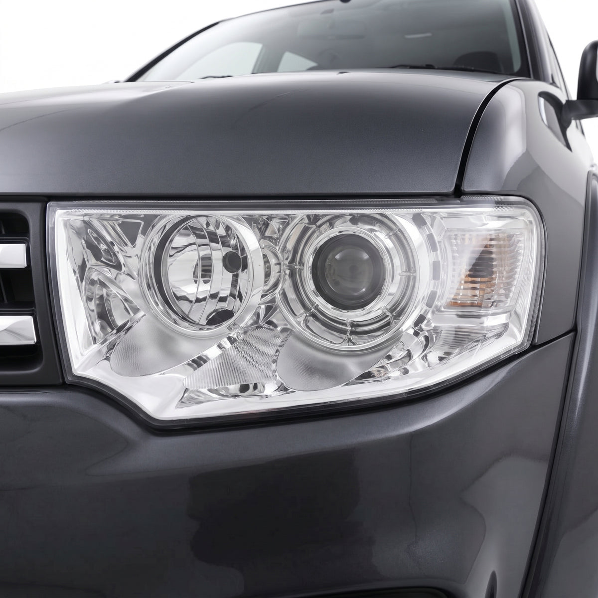 Mitsubishi Challenger PC (2013 - 2015) Clear / Chrome Non-Xenon OEM Style Headlights LH + RH installed close-up