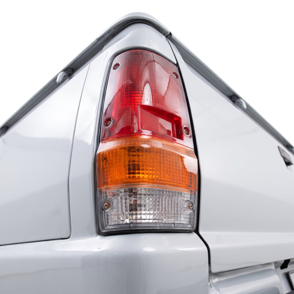 Mitsubishi L200 Express MD (1984 - 1986) Red / Amber / Clear OEM Style Tail Lights LH + RH installed close-up