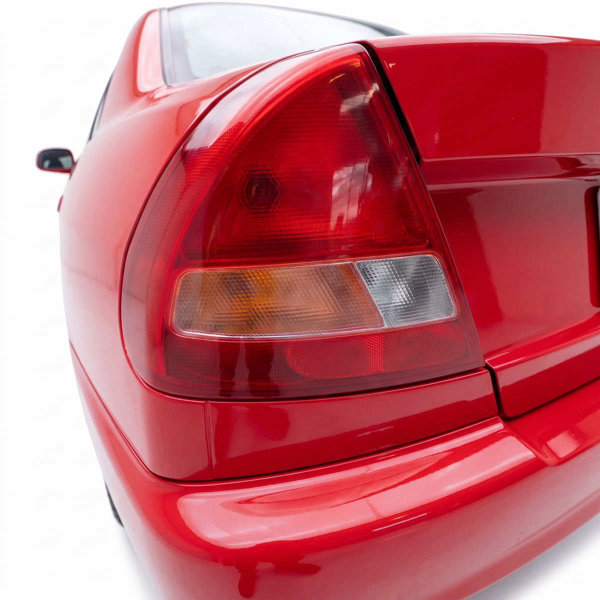 Mitsubishi Lancer CE (1996 - 1998) Red / Clear OEM Style Tail Lights LH + RH installed close-up