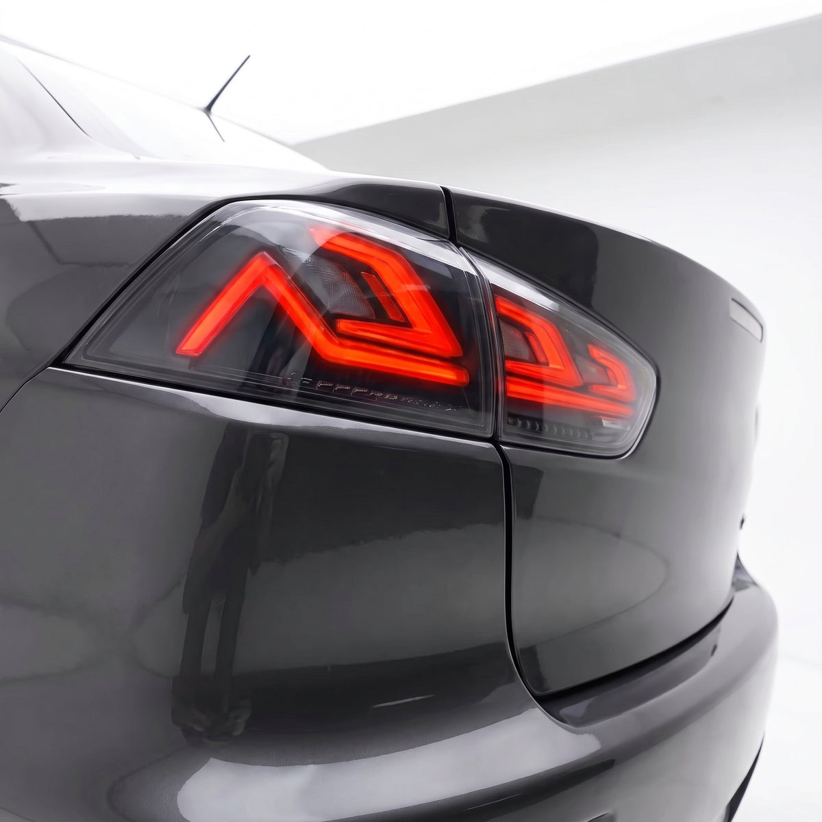 Mitsubishi Lancer Evo X / CJ / CF (2008 - 2018) Sequential Smoked LED Tail Lights LH + RH installed close-up