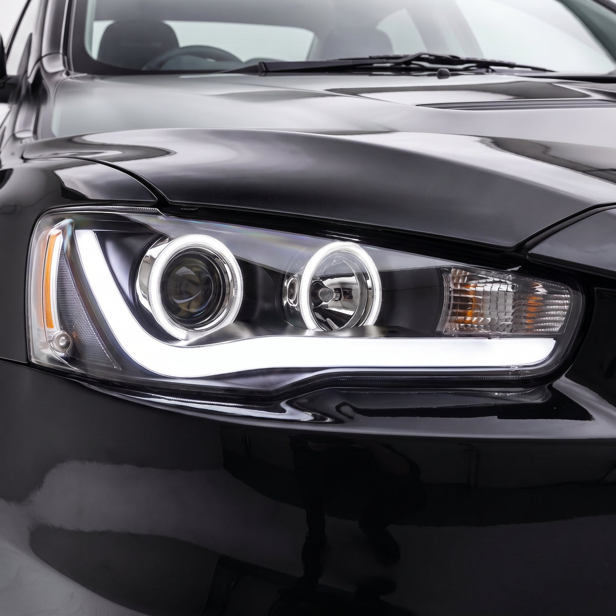 Mitsubishi Lancer Evolution X CF CJ Sedan (2007 - 2017) Sequential Headlights LH + RH installed close-up