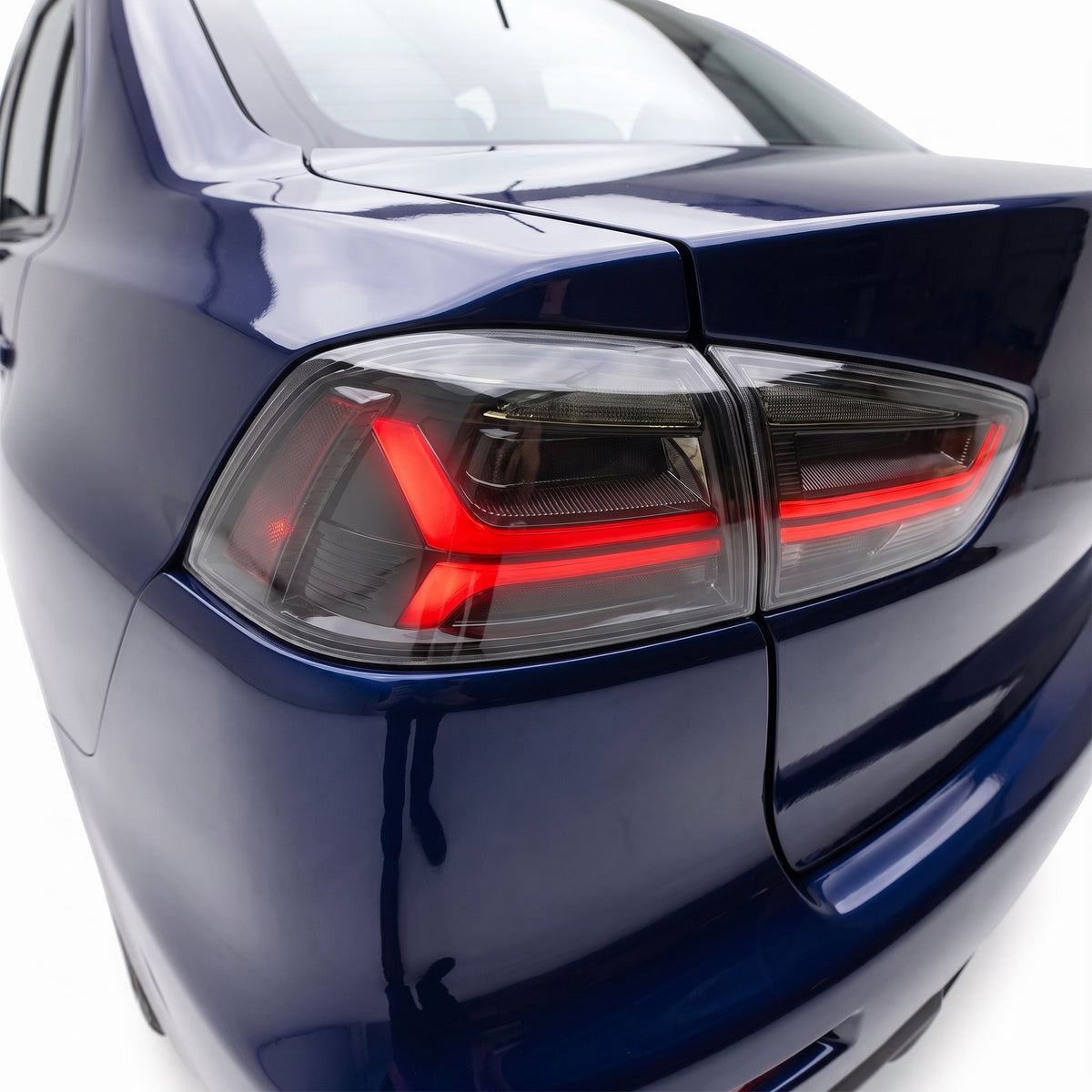 Mitsubishi Lancer Evolution X CF CJ Sedan (2007 - 2017) Sequential Smoked Tail Lights LH + RH installed close-up