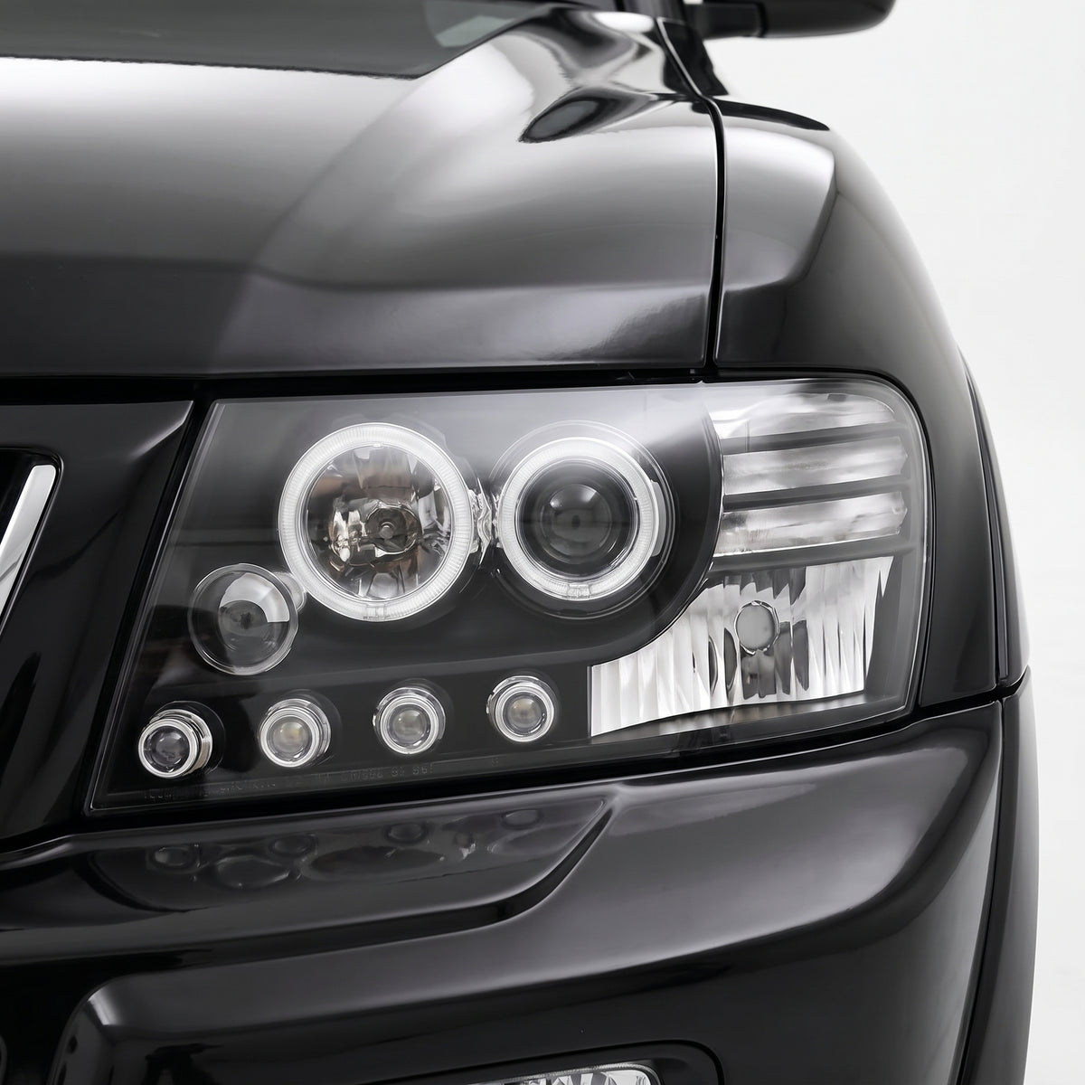 Mitsubishi Pajero NM / NP (2000 - 2006) Black High Power LED Angel Eyes Projector Headlights LH + RH installed