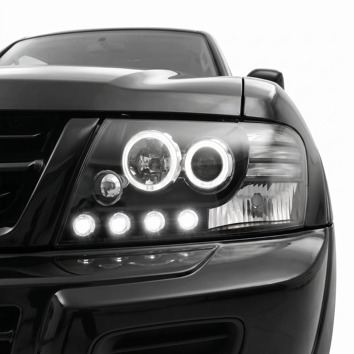 Mitsubishi Pajero NM / NP (2000 - 2006) High power LED Angel Eyes Projector Headlights LH + RH installed close-up