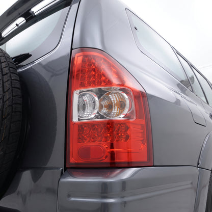 Mitsubishi Pajero NM / NP (2000 - 2006) Smoked Red LED Tail Lights LH + RH installed close-up