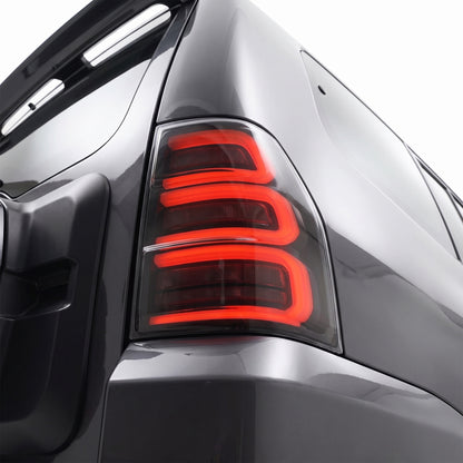 Mitsubishi Pajero NS / NT / NW / NX (2007 - 2021) Smoked White Sequential Full 3D LED Stripe Bar Tail Lights LH + RH installed close-up