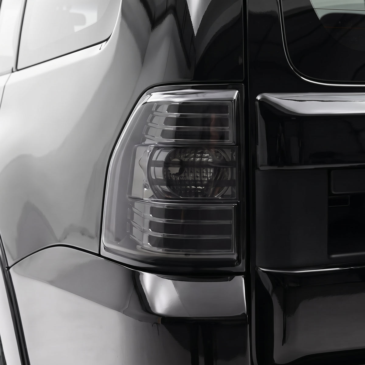 Mitsubishi Pajero NS / NT / NW (2007 - 2021) Full Smoked LED Stripe Bar Tail Lights LH + RH installed close-up