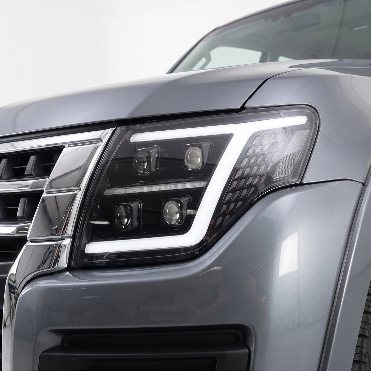 Mitsubishi Pajero NT / NW / NX (2009 - 2021) Quad Projector LED Style Sequential Indicator Headlights LH + RH installed close-up