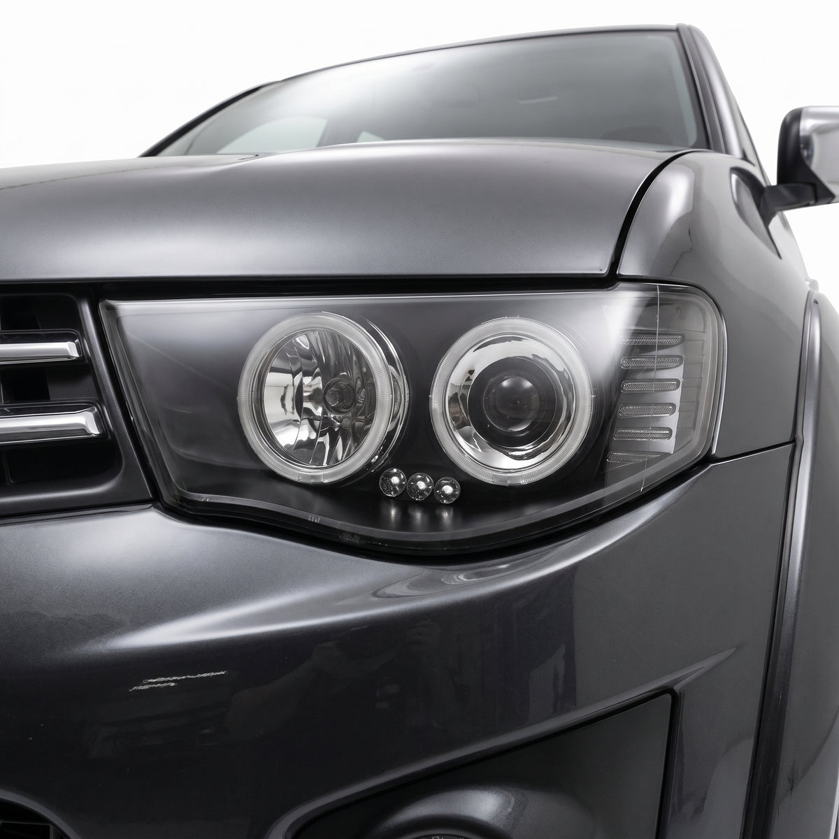 Mitsubishi Triton ML / MN (2006 - 2015) Black High Power LED Angel-Eyes Projector Headlights LH + RH installed close-up