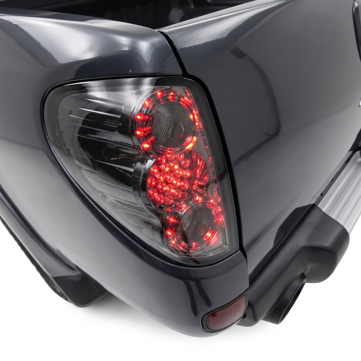 Mitsubishi Triton ML / MN (2006 - 2015) Smoked Black LED Tail Lights LH + RH installed close-up