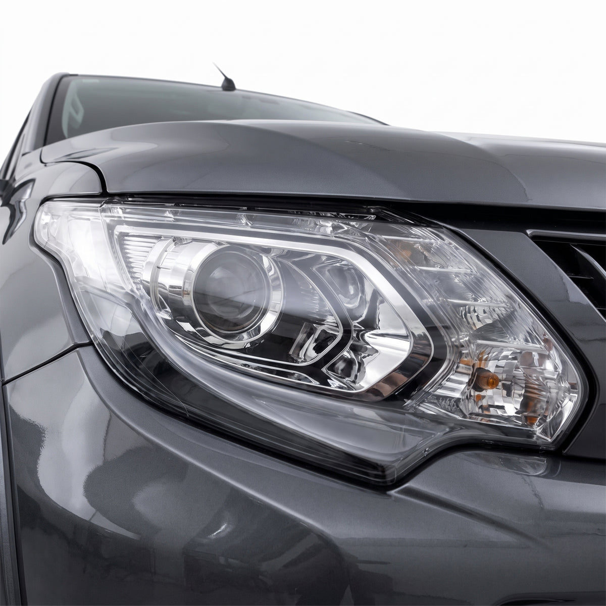 Mitsubishi Triton MQ (2015 - 2018) Black Xenon Projector OEM Style Headlights LH + RH installed close-up
