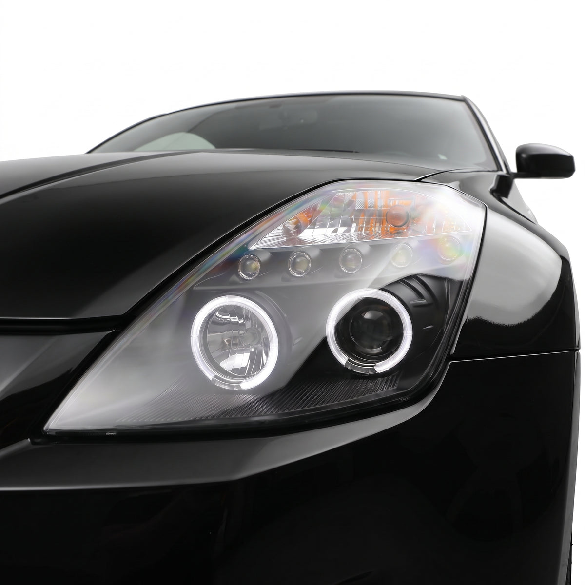 Nissan 350Z Z33 Series 1 (2003 - 2005) Black Angel Eyes Projector Headlights LH + RH installed close-up