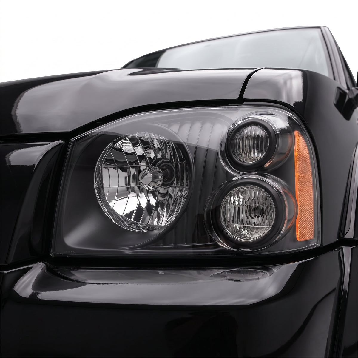 Nissan Navara D22 (2001 - 2015) Black Headlights LH + RH installed close-up