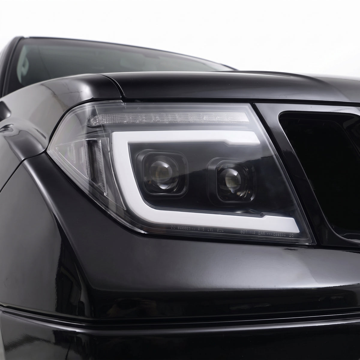 Nissan Navara D40 (2005 - 2014) Black DRL Projector With LED Sequential Indicators Headlights LH + RH installed close-up