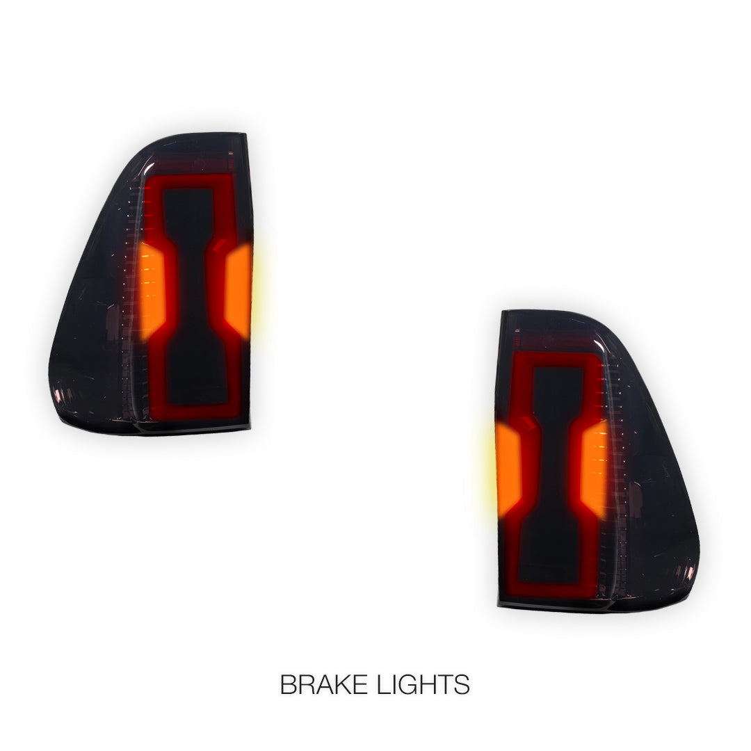 Toyota HiLux N80 (2015 - 2025) Sequential Smoked 3D Stripe Bar Full LED Tail Lights LH + RH