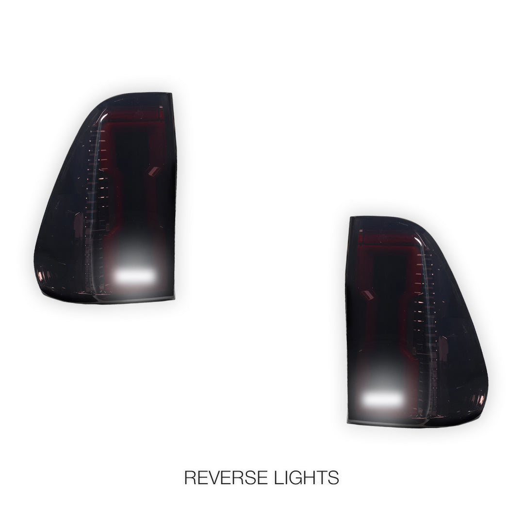 Toyota HiLux N80 (2015 - 2025) Sequential Smoked 3D Stripe Bar Full LED Tail Lights LH + RH