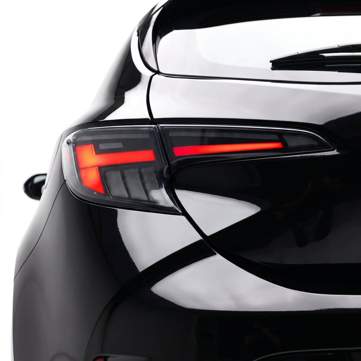 Toyota Corolla E210 Hatch (2019 - 2024) Black LED Sequential Tail Lights LH + RH installed close-up
